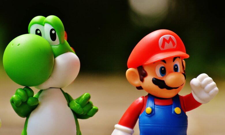 Detailed close-up of Mario and Yoshi figurines from a popular video game franchise.