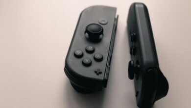 A close-up image of two Nintendo Switch Joy-Con controllers on a neutral background.