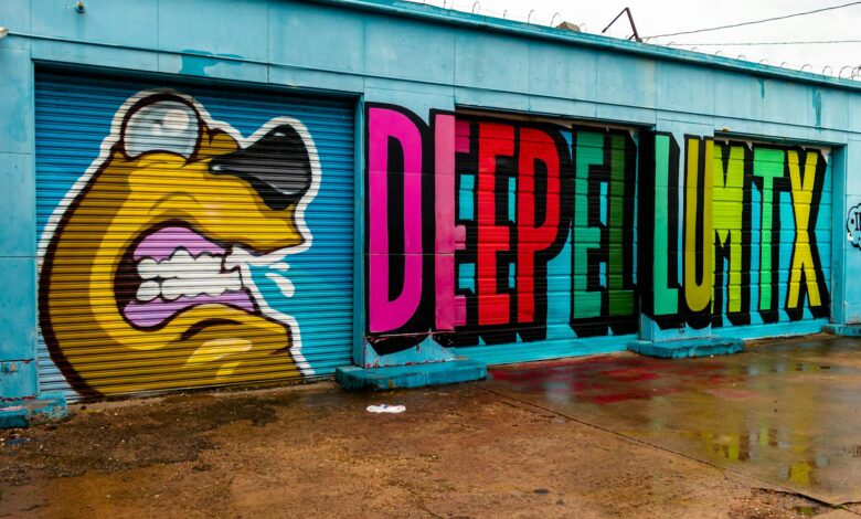 Colorful graffiti featuring bold text and cartoon design on urban garage doors.