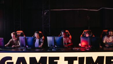 A group of diverse gamers participating in an online eSports tournament indoors.