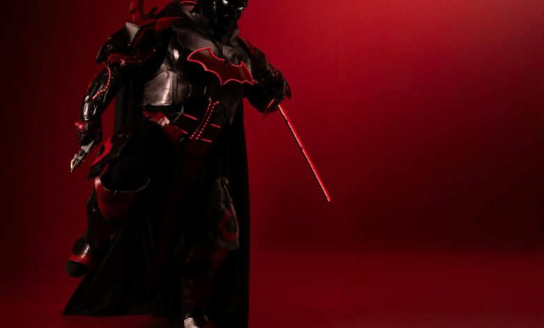 Detailed Batman cosplay in red-black theme, captured with dramatic lighting and mood.
