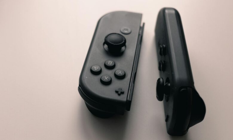 A close-up image of two Nintendo Switch Joy-Con controllers on a neutral background.