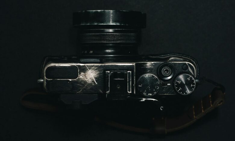 A top view of a vintage camera with dials on a dark background, showcasing retro design.