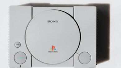 Close-up of a classic Sony PlayStation console on a white background