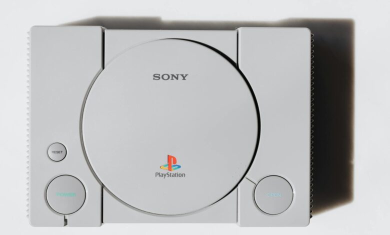 Close-up of a classic Sony PlayStation console on a white background