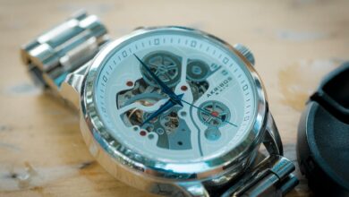 Close-up of a luxury skeleton watch featuring a brushed metal band and intricate mechanics.