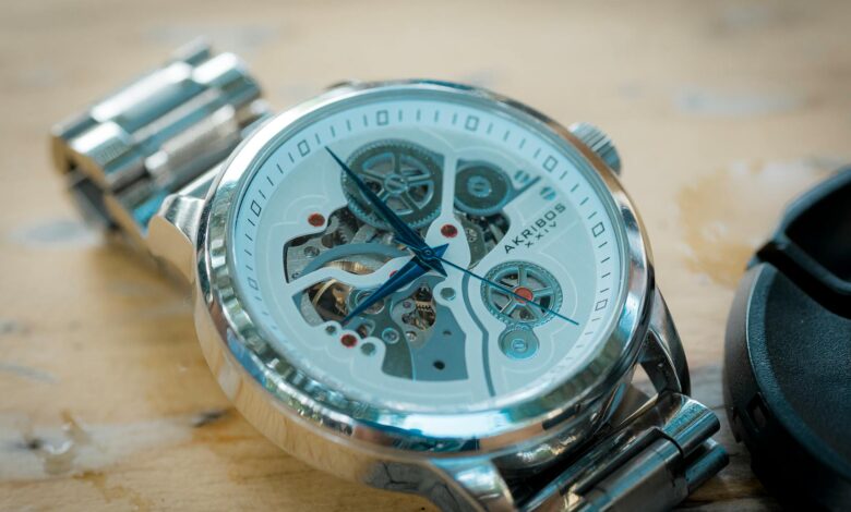 Close-up of a luxury skeleton watch featuring a brushed metal band and intricate mechanics.