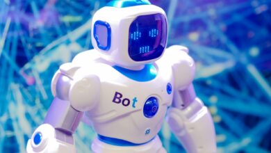 High-tech humanoid robot with LED face display, showcasing modern robotics and innovation.