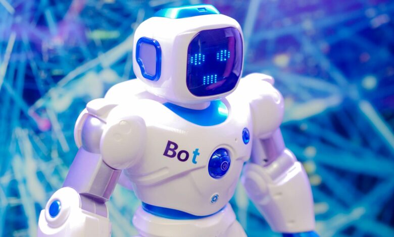 High-tech humanoid robot with LED face display, showcasing modern robotics and innovation.