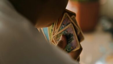A child engaged in playing a card game indoors, focused on strategy and fun.