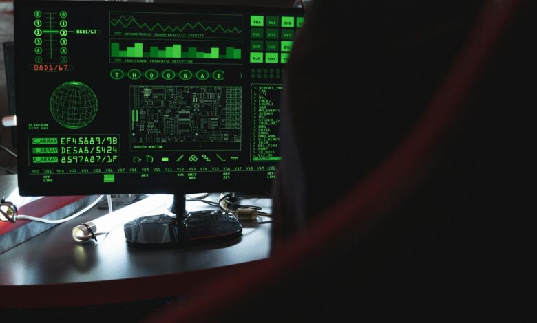 View of a computer monitor displaying green digital security code in an indoor setting.