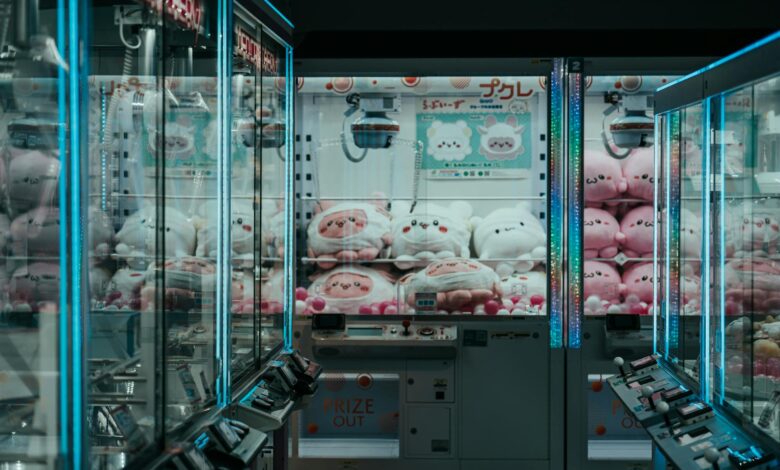 A vibrant shot of Japanese arcade claw machines filled with plush toys, highlighting urban leisure.