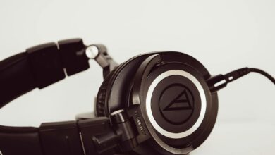 High-quality black studio headphones close-up, ideal for music and audio production environments.