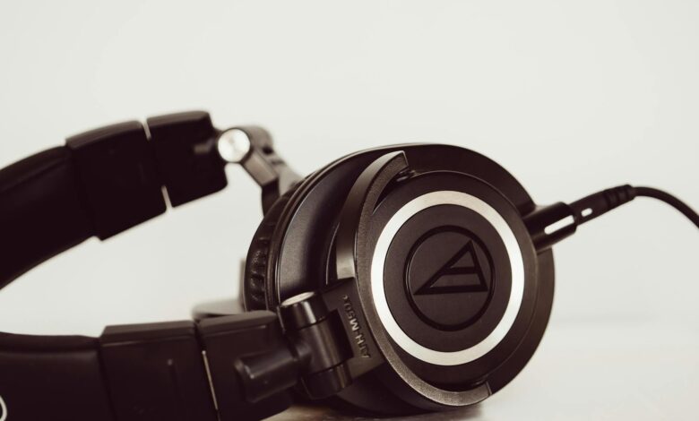 High-quality black studio headphones close-up, ideal for music and audio production environments.