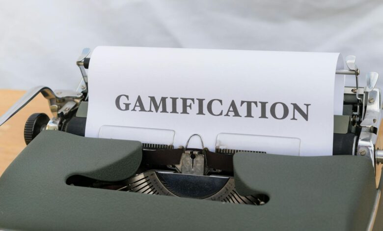 Close-up of a vintage typewriter displaying the word 'Gamification' on paper.