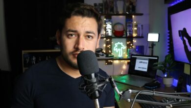 Podcaster in a stylish home studio with microphone and neon lights in Santiago de Querétaro, Mexico.