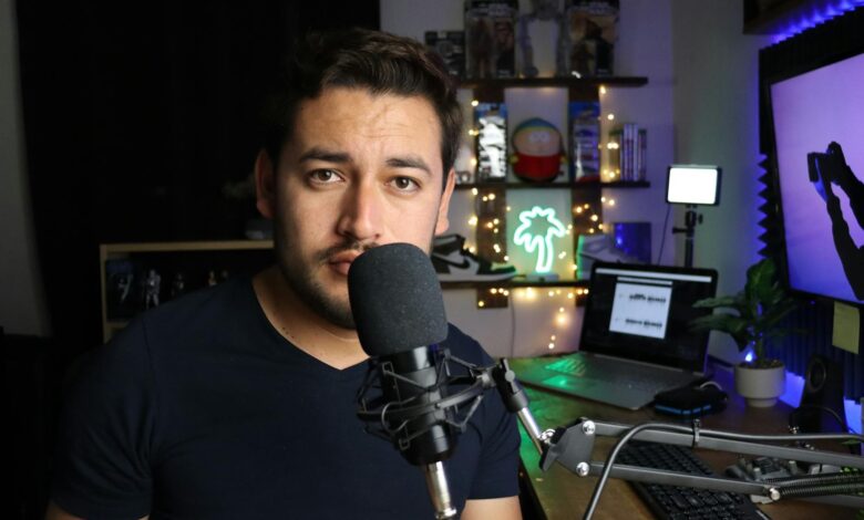 Podcaster in a stylish home studio with microphone and neon lights in Santiago de Querétaro, Mexico.