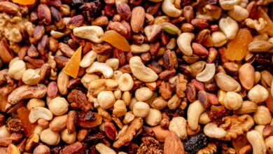 Close-up of assorted nuts and dried fruits creating a colorful, nutritious mix.