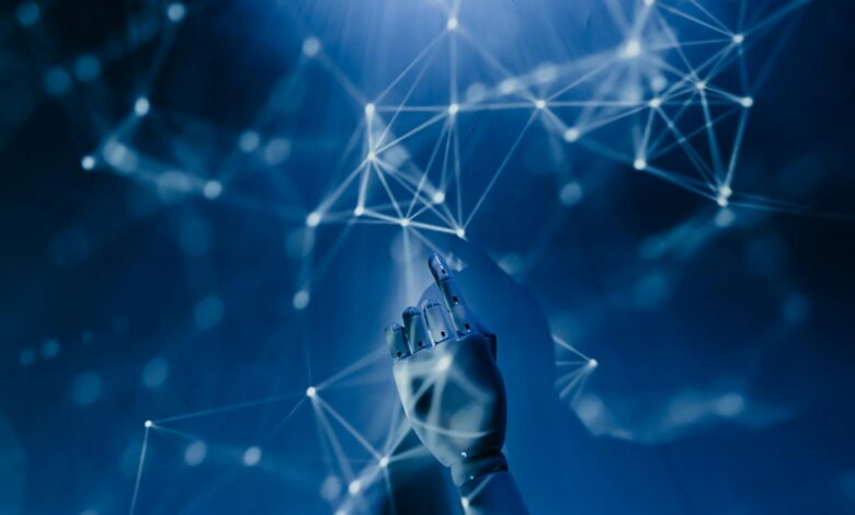 A robotic hand reaching into a digital network on a blue background, symbolizing AI technology.
