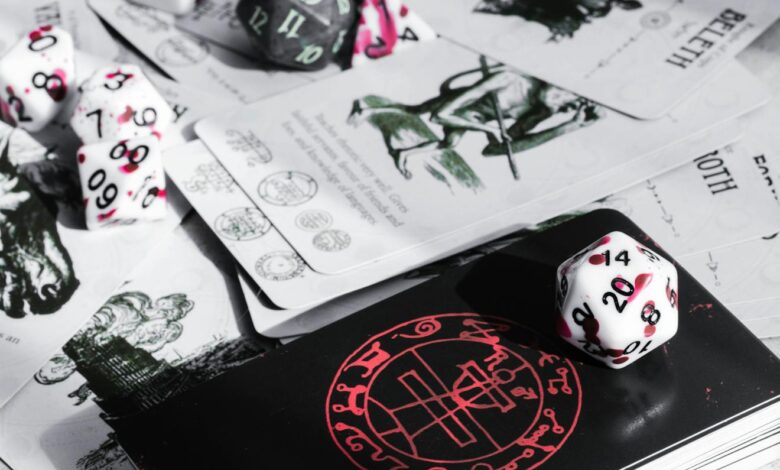 A close-up view of tabletop gaming cards and colorful dice, perfect for game enthusiasts.