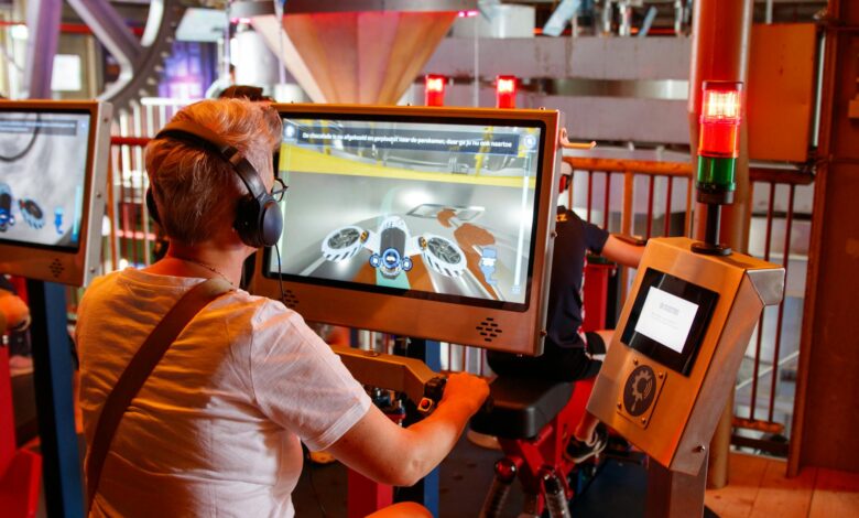 Individual using interactive simulator at a tech exhibit indoors.