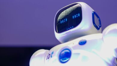 A modern humanoid robot with digital face and luminescent screen, symbolizing innovation in technology.
