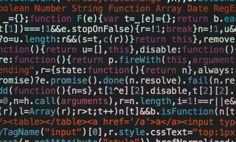 Close-up of colorful coding text on a dark computer screen, representing software development.