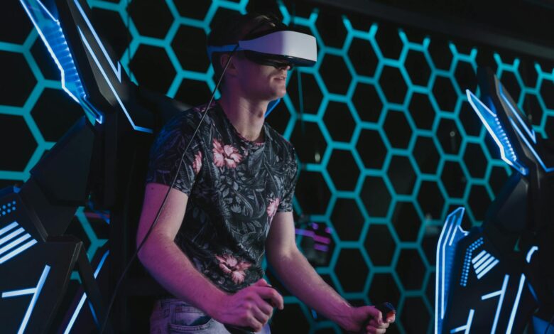 An adult male enjoying a virtual reality game in an arcade setting with futuristic elements.