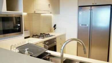 A stylish modern kitchen featuring stainless steel appliances and sleek design elements.
