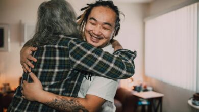 A joyful hug between friends in a cozy room, capturing warmth and friendship.