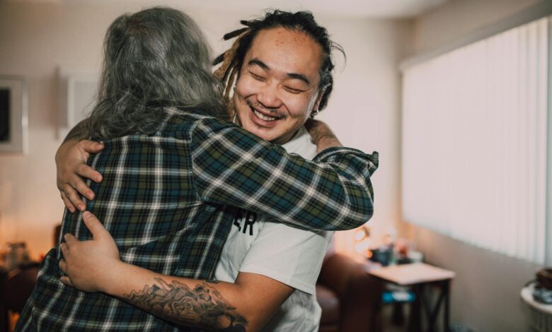 A joyful hug between friends in a cozy room, capturing warmth and friendship.