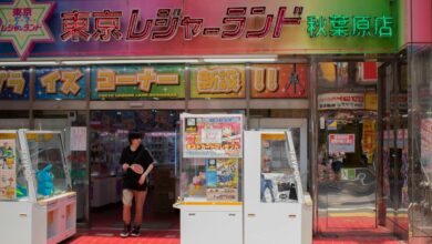 Entrance of Tokyo Leisureland arcade in Akihabara, showcasing gaming machines and vibrant signs.