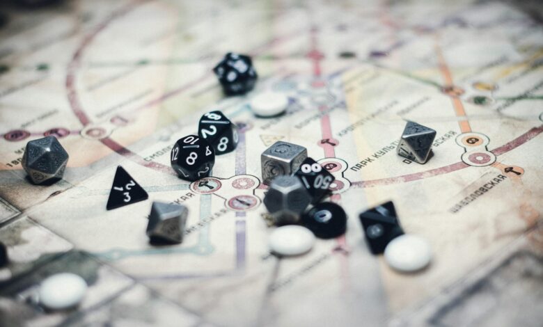 A collection of multi-sided dice on a detailed map, ideal for gaming enthusiasts