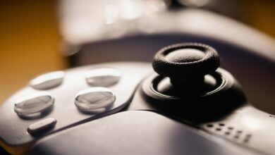 Detailed close-up of a video game controller with focus on buttons and joystick.