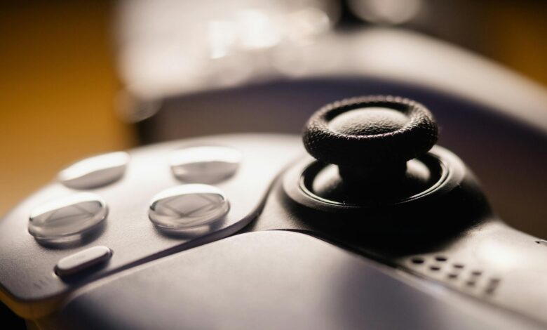 Detailed close-up of a video game controller with focus on buttons and joystick.