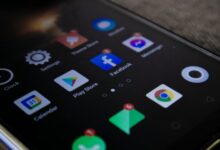 Detailed view of a smartphone screen with popular app icons including Facebook and Messenger.