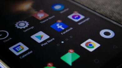 Detailed view of a smartphone screen with popular app icons including Facebook and Messenger.