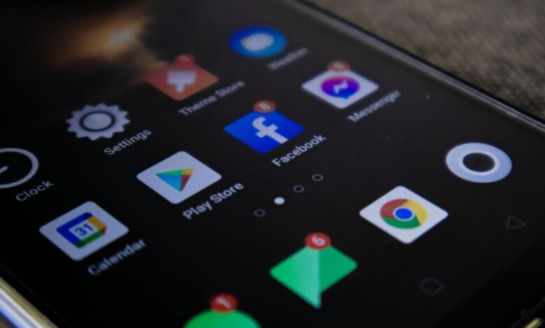 Detailed view of a smartphone screen with popular app icons including Facebook and Messenger.