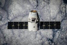 SpaceX Dragon spacecraft in orbit, highlighting advanced space technology with cloud backdrop.