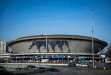 Spodek Arena in Katowice featuring a vibrant esports event atmosphere with banners.