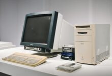 A retro computer setup featuring a classic CRT monitor and vintage CPU, showcasing technology history.