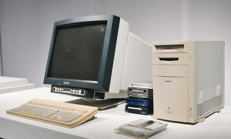 A retro computer setup featuring a classic CRT monitor and vintage CPU, showcasing technology history.