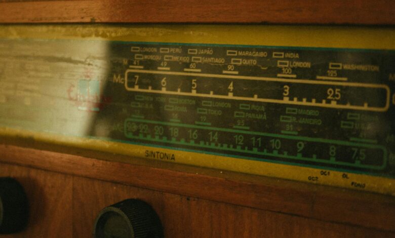 Close-up of a vintage radio tuner displaying frequency dials.