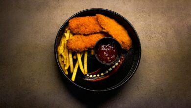 Delicious fried chicken with fries and dipping sauce in Kermanshah, Iran.