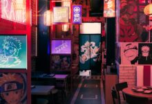 A vibrant anime-themed restaurant with neon lights and Japanese decor in Tokyo.