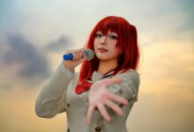 A captivating cosplay performer holding a microphone in an outdoor sunset setting.