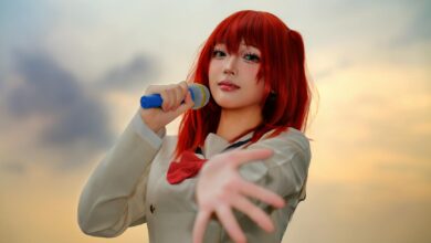 A captivating cosplay performer holding a microphone in an outdoor sunset setting.