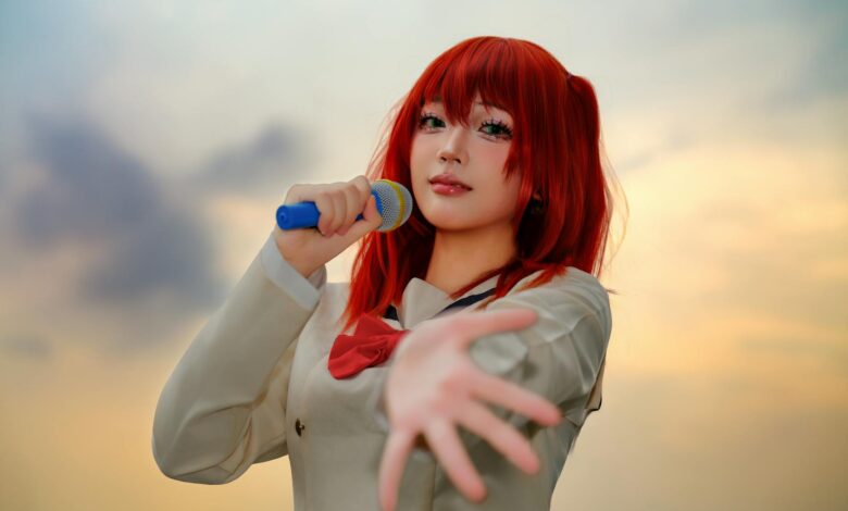 A captivating cosplay performer holding a microphone in an outdoor sunset setting.