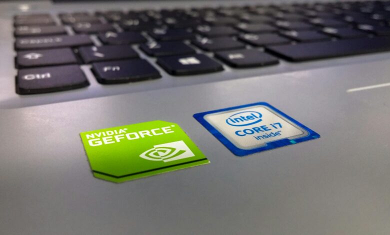 Detailed close-up of a laptop keyboard featuring Intel Core i7 and NVIDIA GeForce stickers, highlighting technology components.