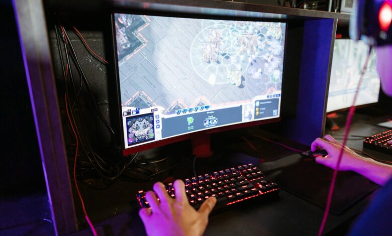 Engaging in an online gaming session with a modern setup, highlighting technology and recreation.